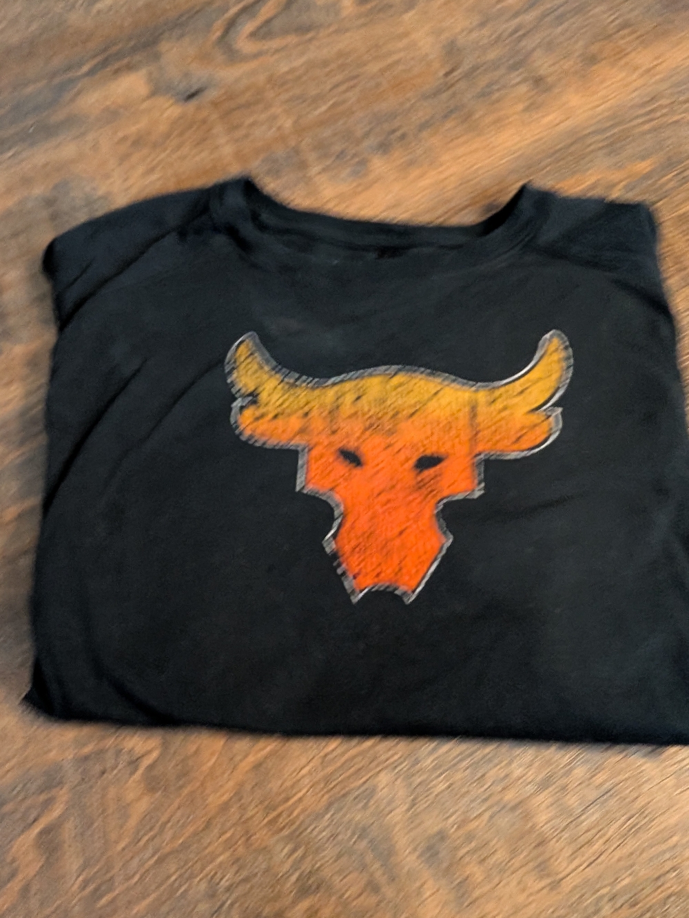 Under Armour The Rock's  Black Tee with Orange-Yellow Bull Graphic